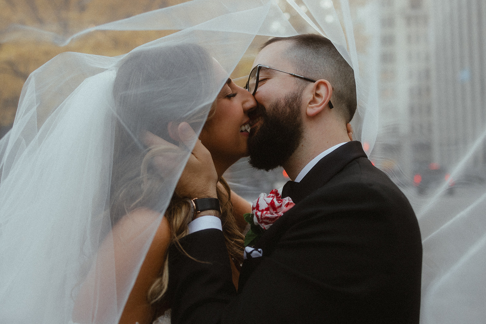 Couple kissing in Old Port of Montreal on their wedding day