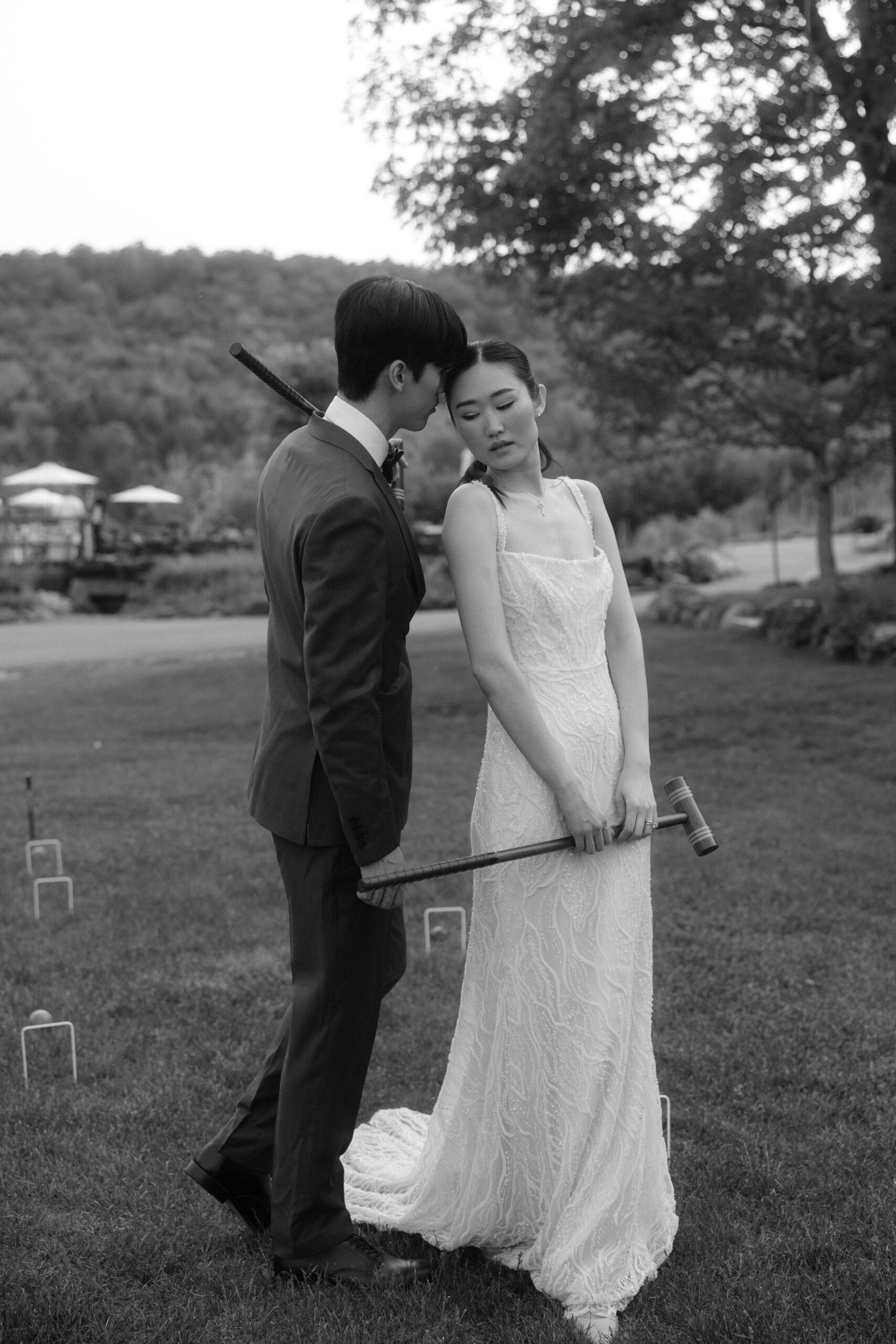 A bridge and groom playing croquet
